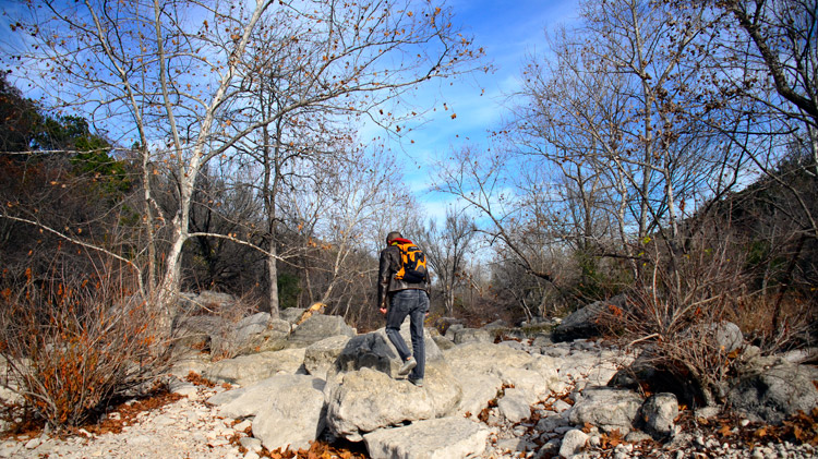 Strolling dried-out Barton Creek during midwinter.